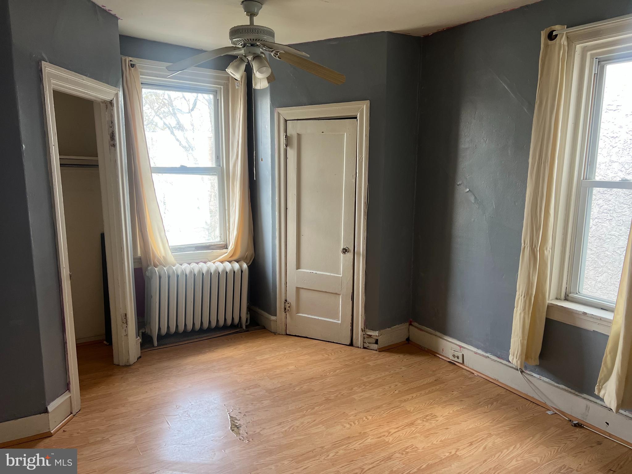 6925 Forrest Avenue Philadelphia, PA 19138 - Photo 6 of 12 an empty room with windows and entrance