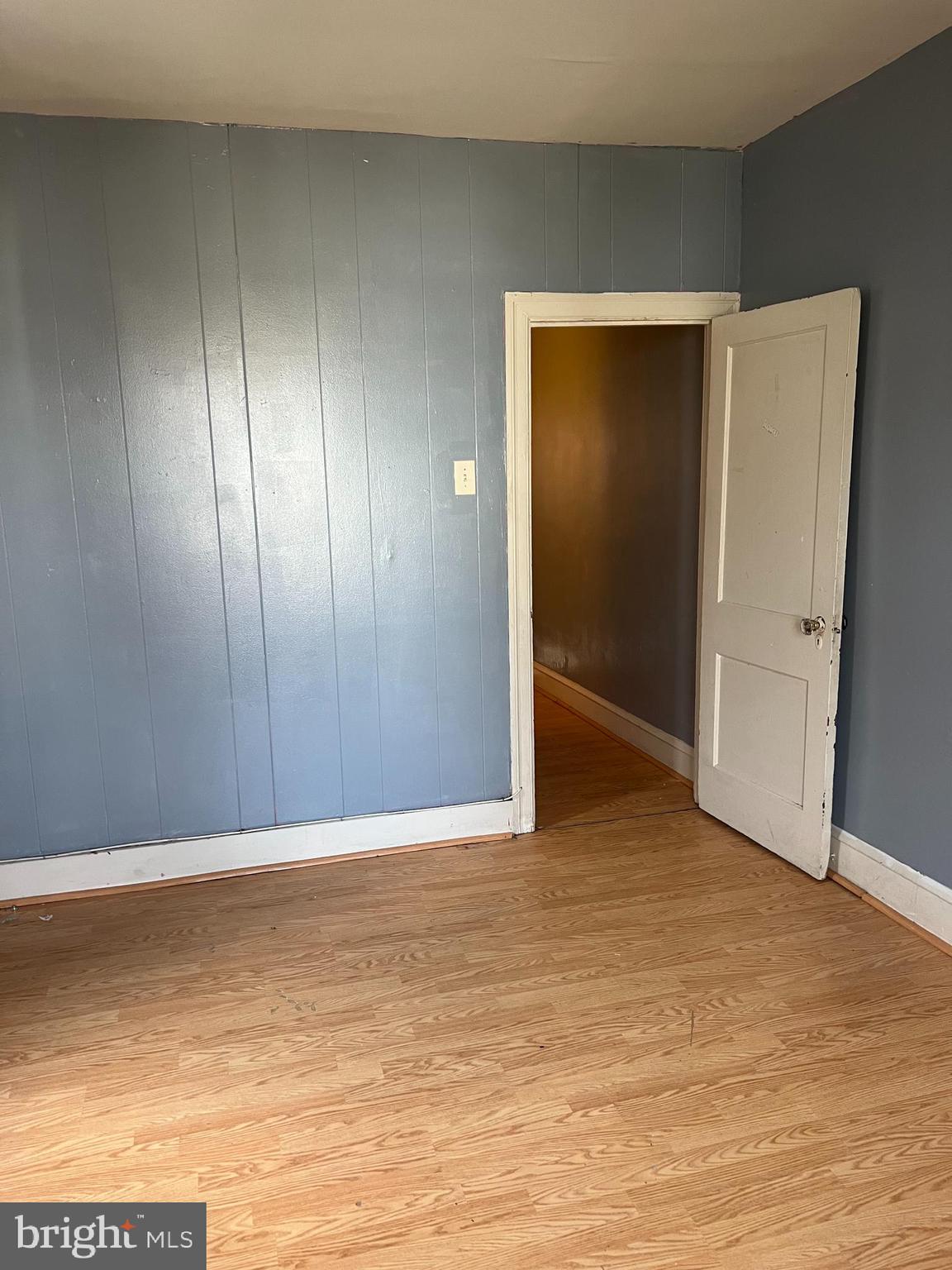 6925 Forrest Avenue Philadelphia, PA 19138 - Photo 7 of 12 a view of an empty room with wooden floor and closet