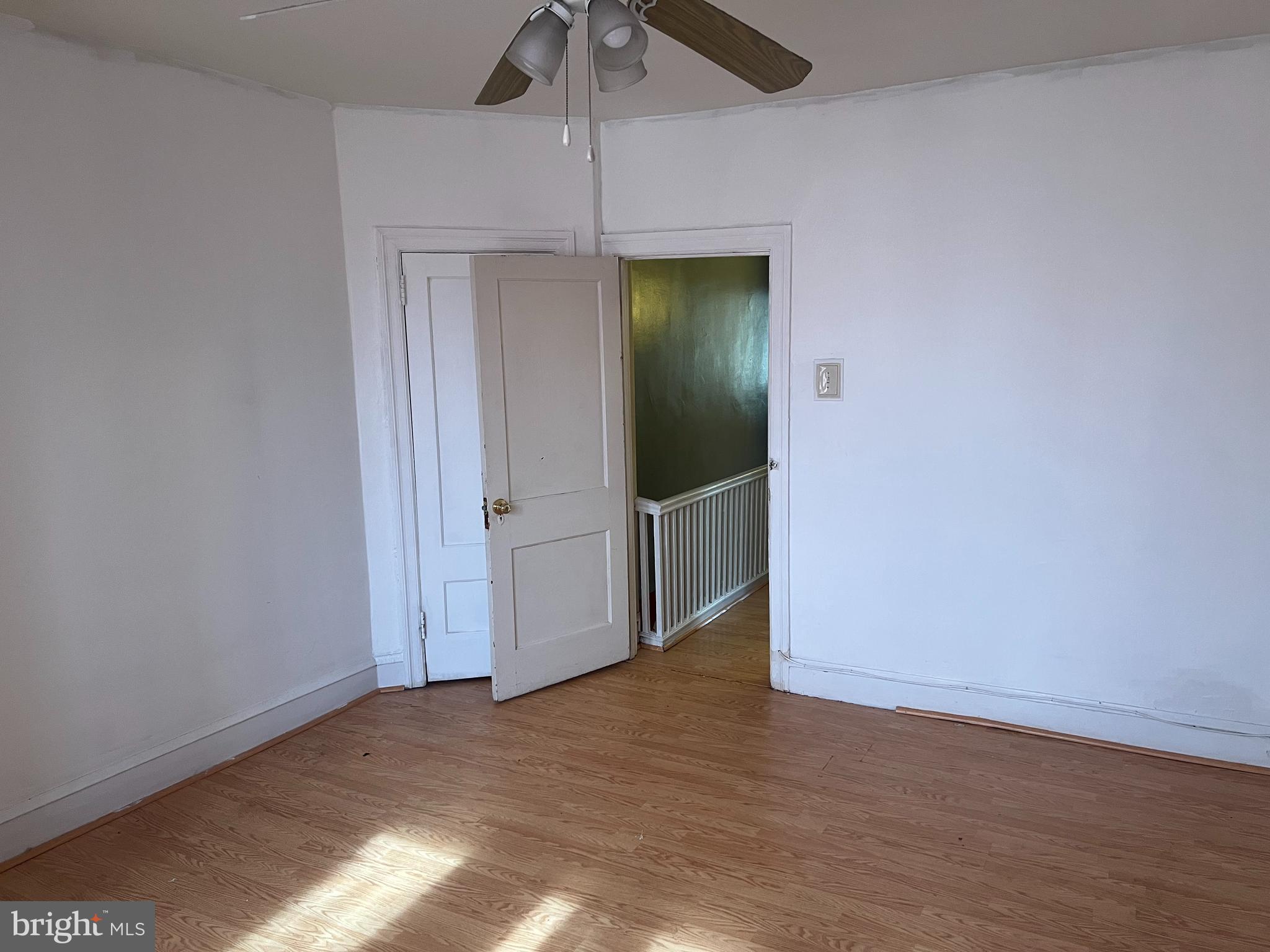 6925 Forrest Avenue Philadelphia, PA 19138 - Photo 10 of 12 an empty room with wooden floor fan and window