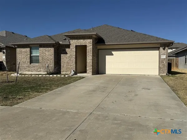 a front view of a house with a outdoor space