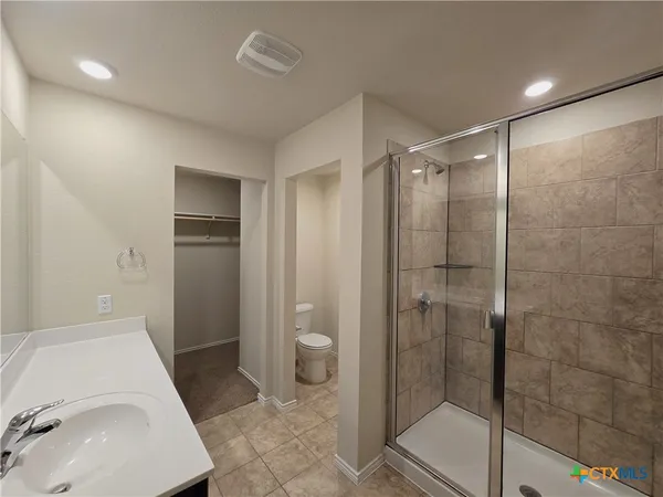 a bathroom with a sink and toilet
