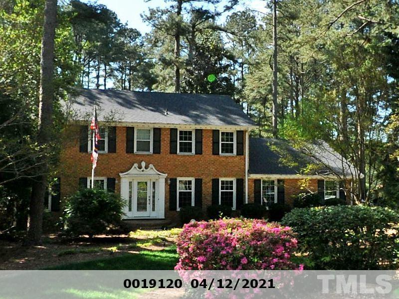 3801 Oak Park Road Raleigh, NC 27612 - Photo 1 of 15 a front view of a house with a garden