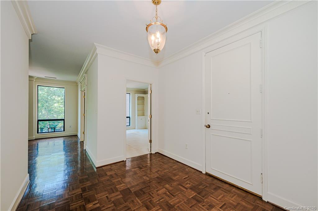 834 Cherokee Road Charlotte, NC 28207 - Photo 2 of 22 wooden floor in an empty room with a window