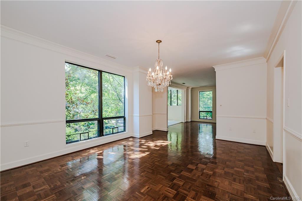 834 Cherokee Road Charlotte, NC 28207 - Photo 11 of 22 a view of an empty room with window and chandelier