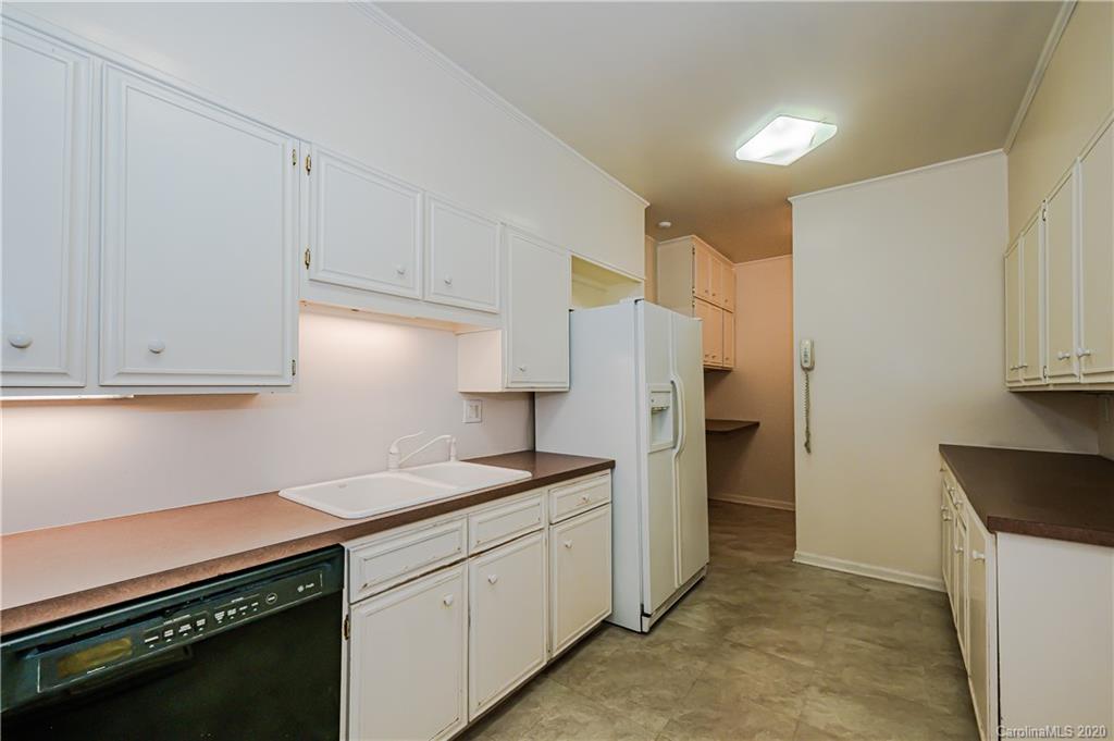 834 Cherokee Road Charlotte, NC 28207 - Photo 14 of 22 a kitchen with stainless steel appliances granite countertop a sink stove and refrigerator