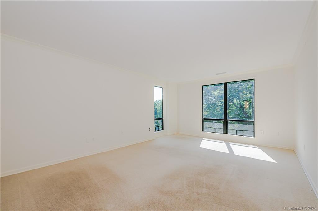 834 Cherokee Road Charlotte, NC 28207 - Photo 17 of 22 a view of an empty room with a window