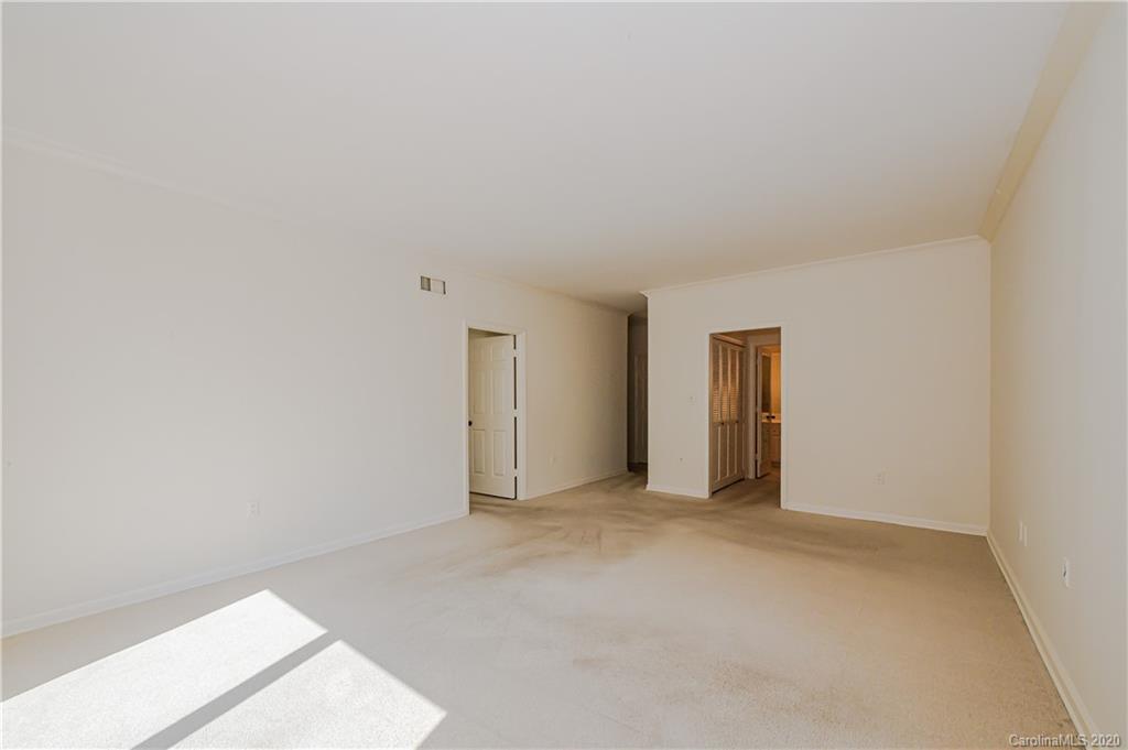 834 Cherokee Road Charlotte, NC 28207 - Photo 18 of 22 a view of an empty room and window