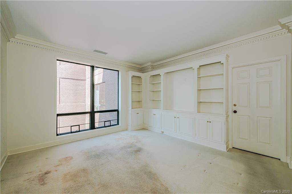 834 Cherokee Road Charlotte, NC 28207 - Photo 4 of 22 a view of an empty room with a window