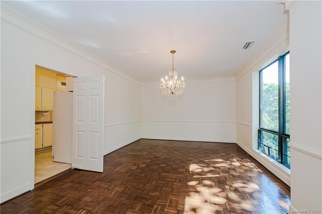 834 Cherokee Road Charlotte, NC 28207 - Photo 10 of 22 a view of a room with window and wooden floor