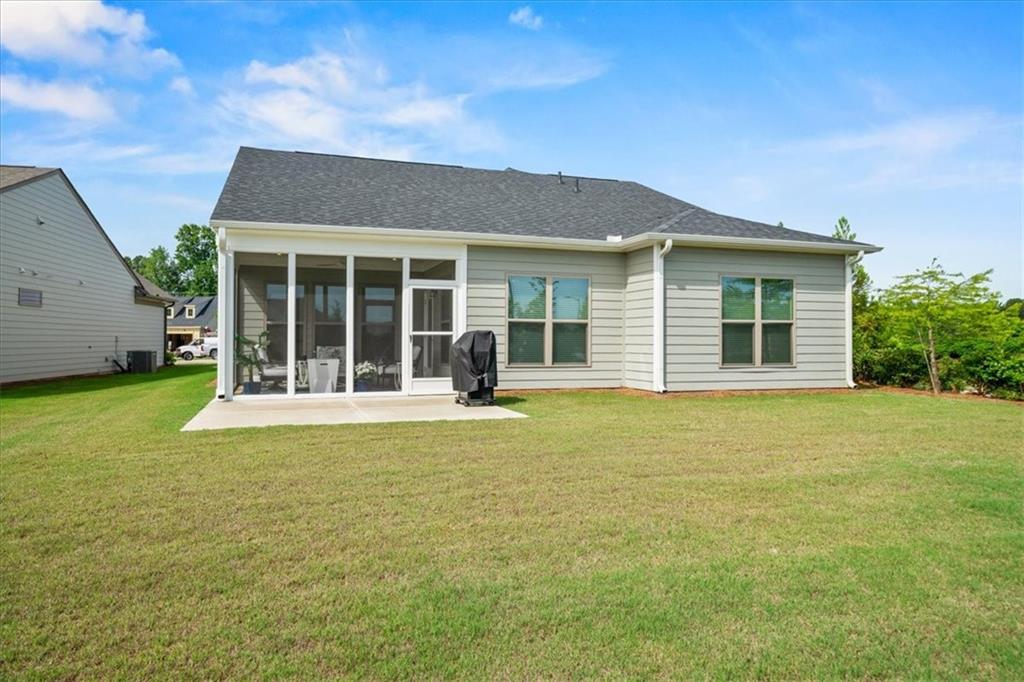 2457 Naples Street Hoschton, GA 30548 - Photo 35 of 41 front view of a house with a garden