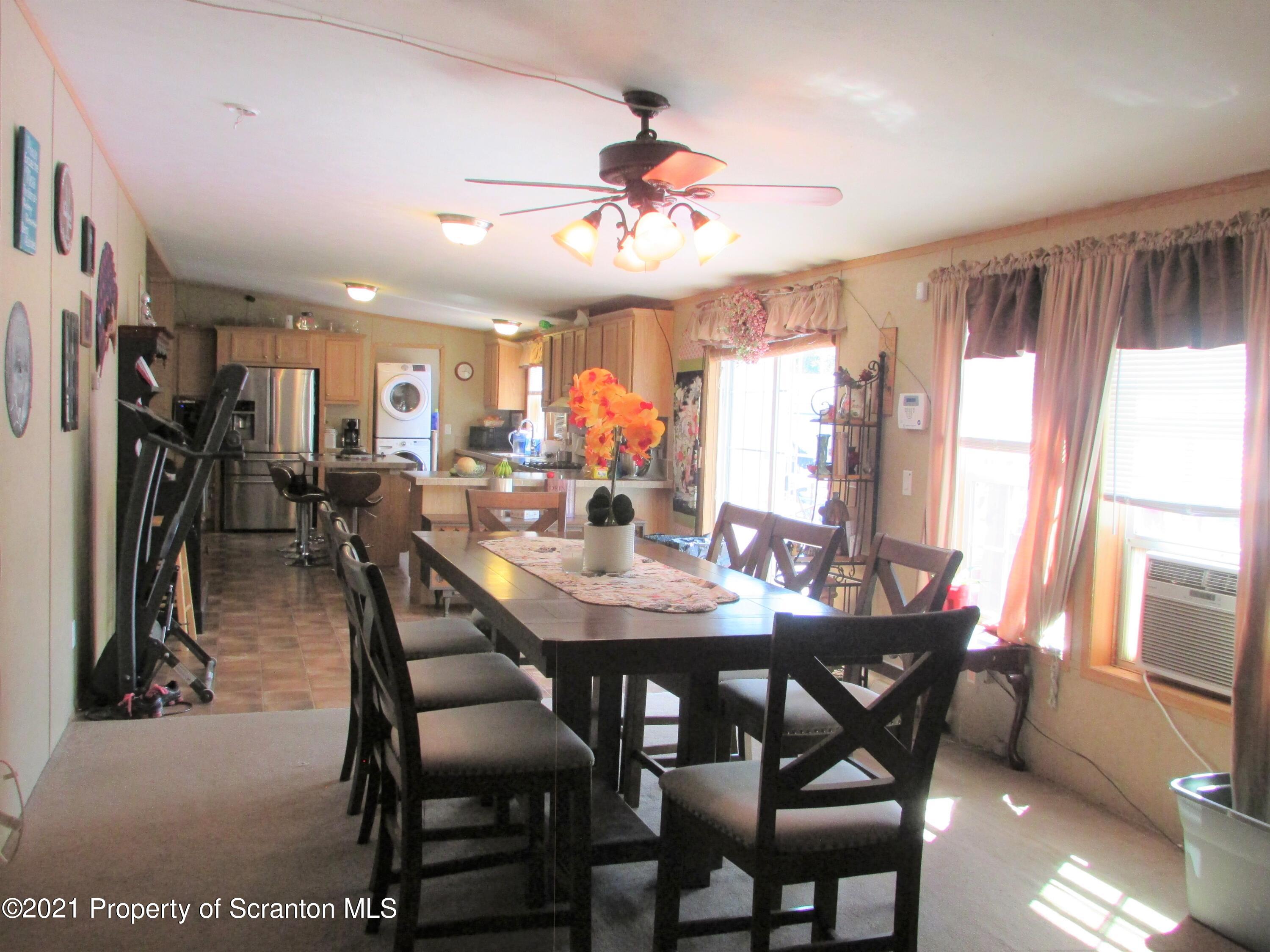 8841 Leraysville Road Rome, PA 18837 - Photo 4 of 32 a view of a dining room with furniture