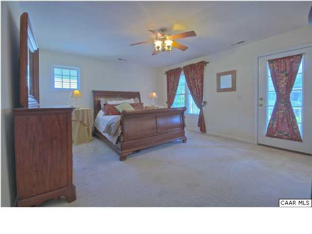 913 Raymond Road Charlottesville, VA 22902 - Photo 11 of 31 a living room with furniture and a chandelier