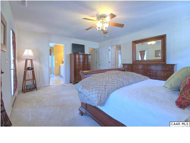 913 Raymond Road Charlottesville, VA 22902 - Photo 12 of 31 a living room with furniture and a chandelier