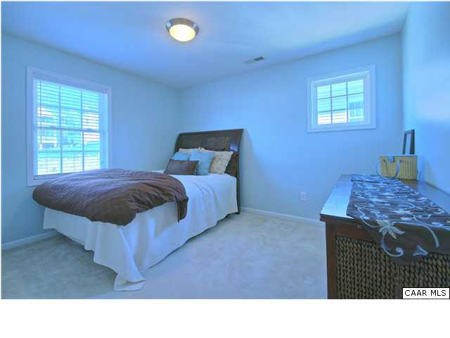 913 Raymond Road Charlottesville, VA 22902 - Photo 15 of 31 a living room with a bed furniture and next to a window