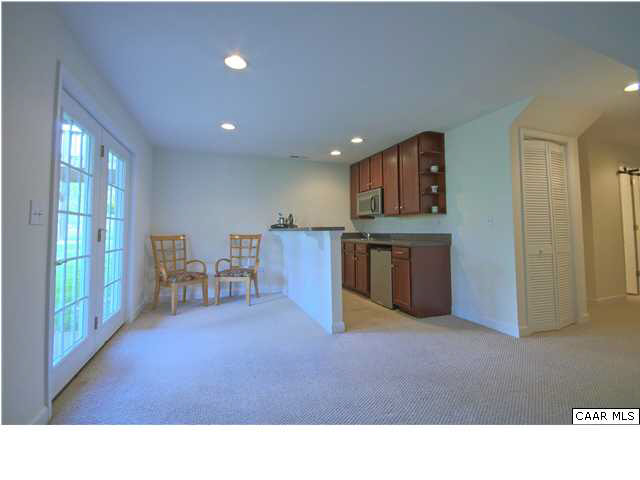 913 Raymond Road Charlottesville, VA 22902 - Photo 22 of 31 a open kitchen with stainless steel appliances granite countertop a refrigerator a stove top oven a sink with granite countertops and cabinets