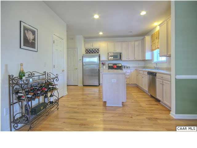 913 Raymond Road Charlottesville, VA 22902 - Photo 4 of 31 a kitchen with kitchen island a counter top space a sink stainless steel appliances and cabinets