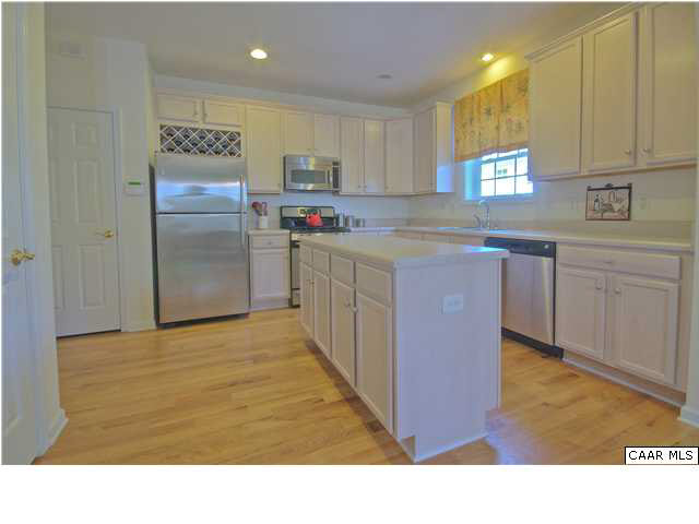 913 Raymond Road Charlottesville, VA 22902 - Photo 5 of 31 a kitchen with kitchen island a sink stainless steel appliances and cabinets