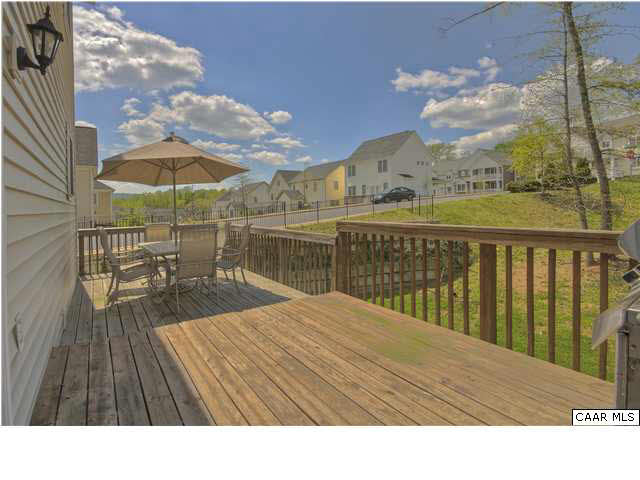 913 Raymond Road Charlottesville, VA 22902 - Photo 10 of 31 a balcony with furniture and wooden floor