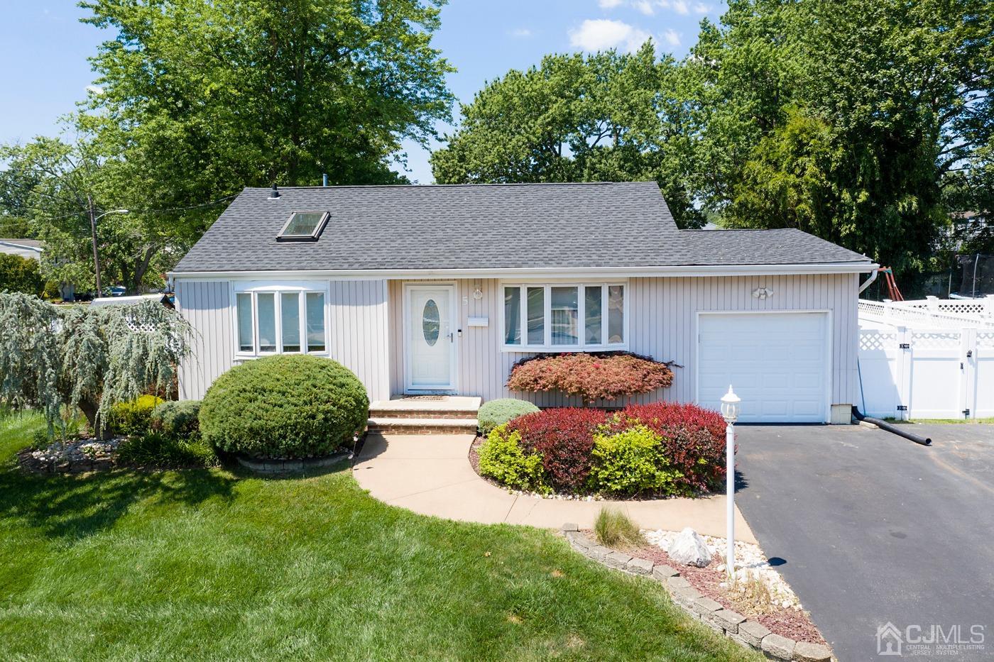 5 Thomas Street Old Bridge, NJ 08857 - Photo 1 of 36 a front view of a house with a yard and outdoor seating