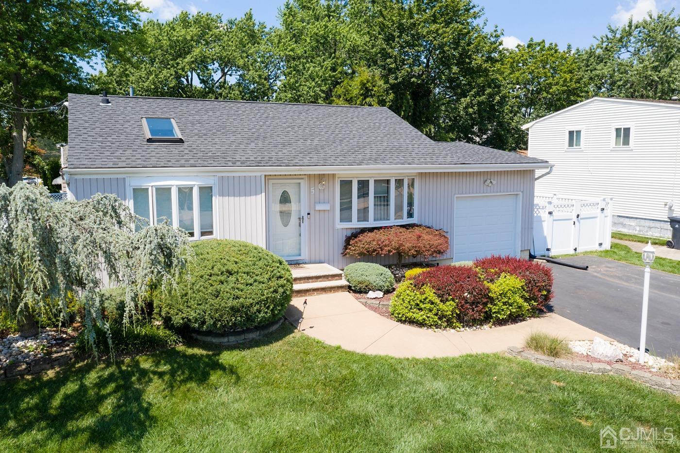 5 Thomas Street Old Bridge, NJ 08857 - Photo 2 of 36 a front view of a house with a garden