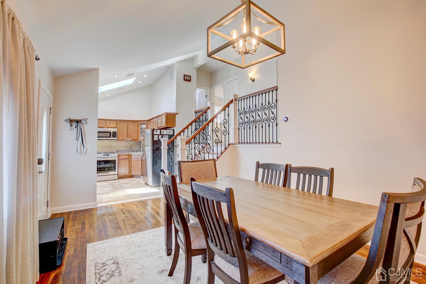 5 Thomas Street Old Bridge, NJ 08857 - Photo 14 of 36 a dining room with furniture and wooden floor