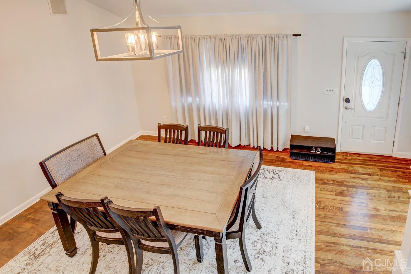 5 Thomas Street Old Bridge, NJ 08857 - Photo 15 of 36 a bedroom with a bed and a chandelier