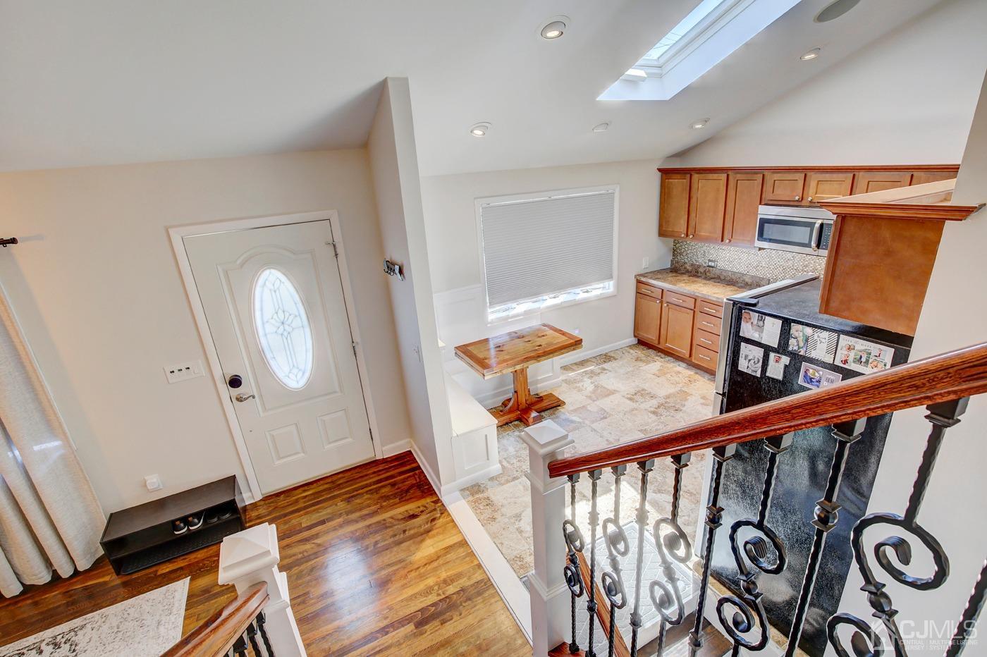5 Thomas Street Old Bridge, NJ 08857 - Photo 18 of 36 a view of a hallway with furniture and a rug