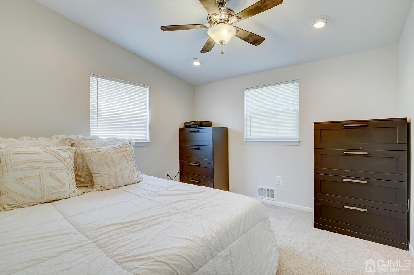 5 Thomas Street Old Bridge, NJ 08857 - Photo 24 of 36 a bedroom with a bed and a ceiling fan