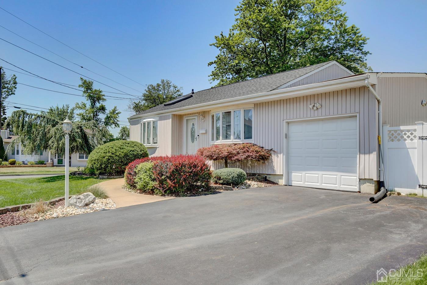 5 Thomas Street Old Bridge, NJ 08857 - Photo 33 of 36 a front view of a house with garden