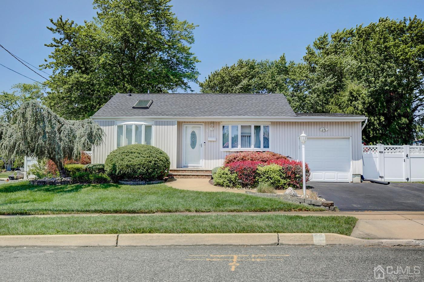 5 Thomas Street Old Bridge, NJ 08857 - Photo 36 of 36 a front view of a house with a garden and plants