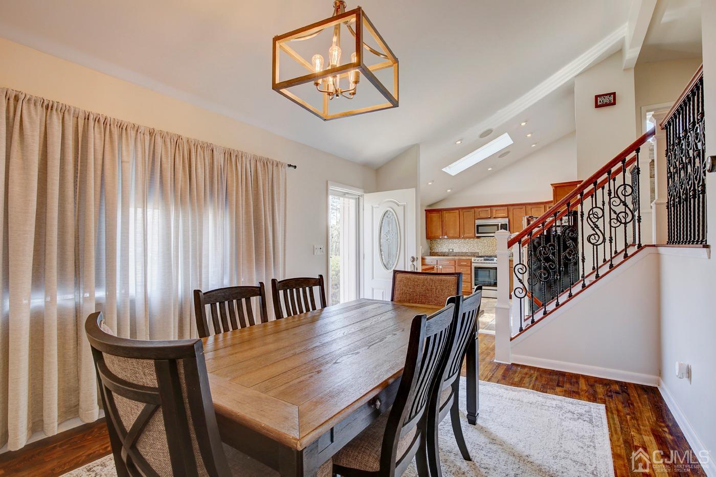 5 Thomas Street Old Bridge, NJ 08857 - Photo 6 of 36 a view of a dining room with furniture and wooden floor