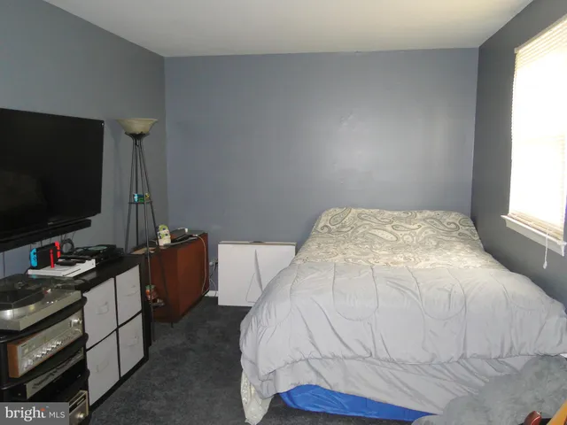 a view of room with wooden floor