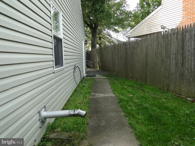 a view of a house and a back yard
