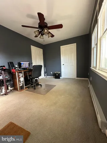 a view of a livingroom with furniture and a chandelier