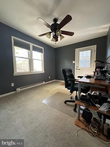 a room with gym equipment and a window