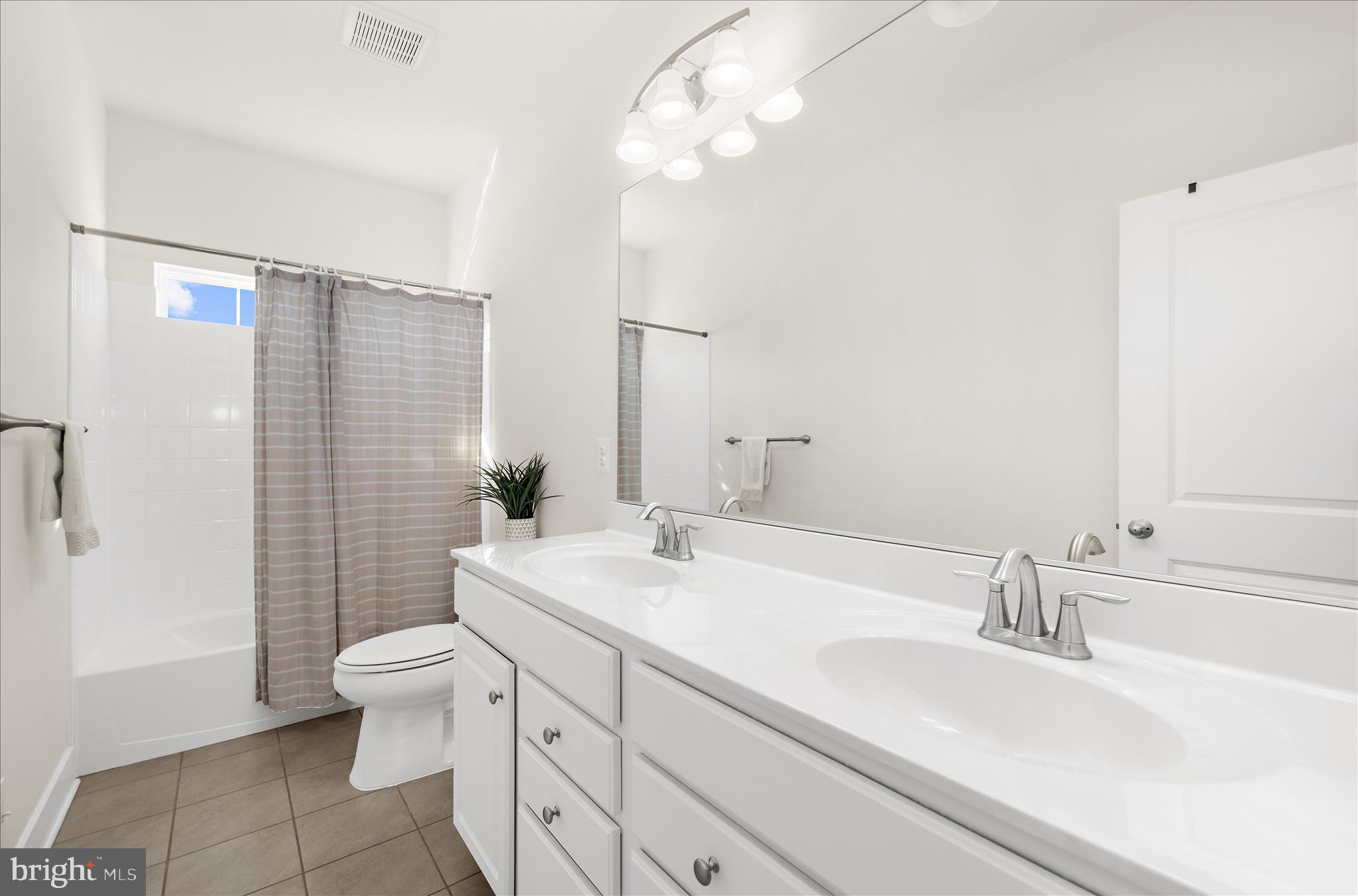 211 Harvest Blossom Road Millersville, MD 21108 - Photo 29 of 87 a bathroom with a sink a toilet and shower