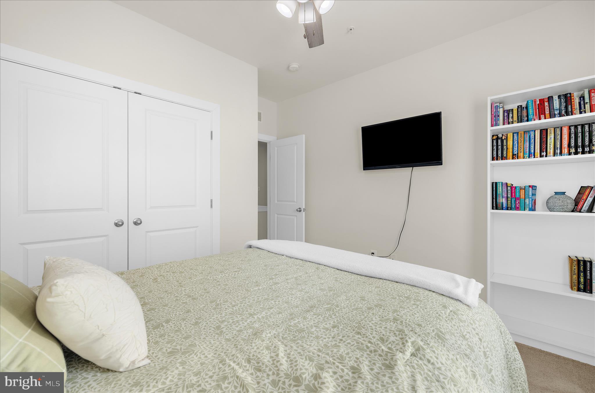 211 Harvest Blossom Road Millersville, MD 21108 - Photo 30 of 87 a bedroom with a bed and a flat screen tv