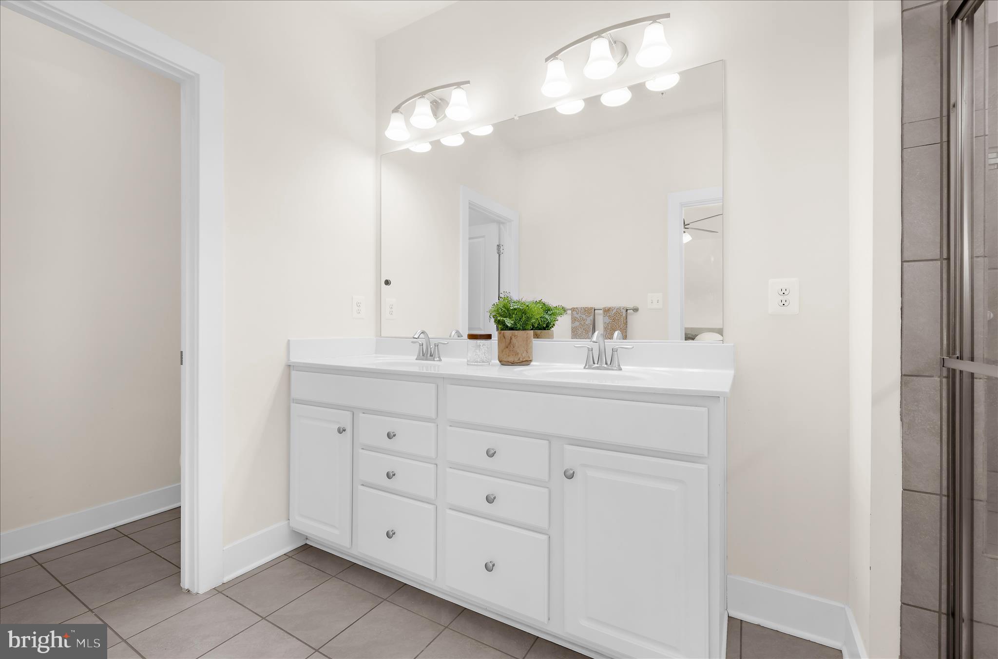 211 Harvest Blossom Road Millersville, MD 21108 - Photo 47 of 87 a bathroom with a double vanity sink and a mirror