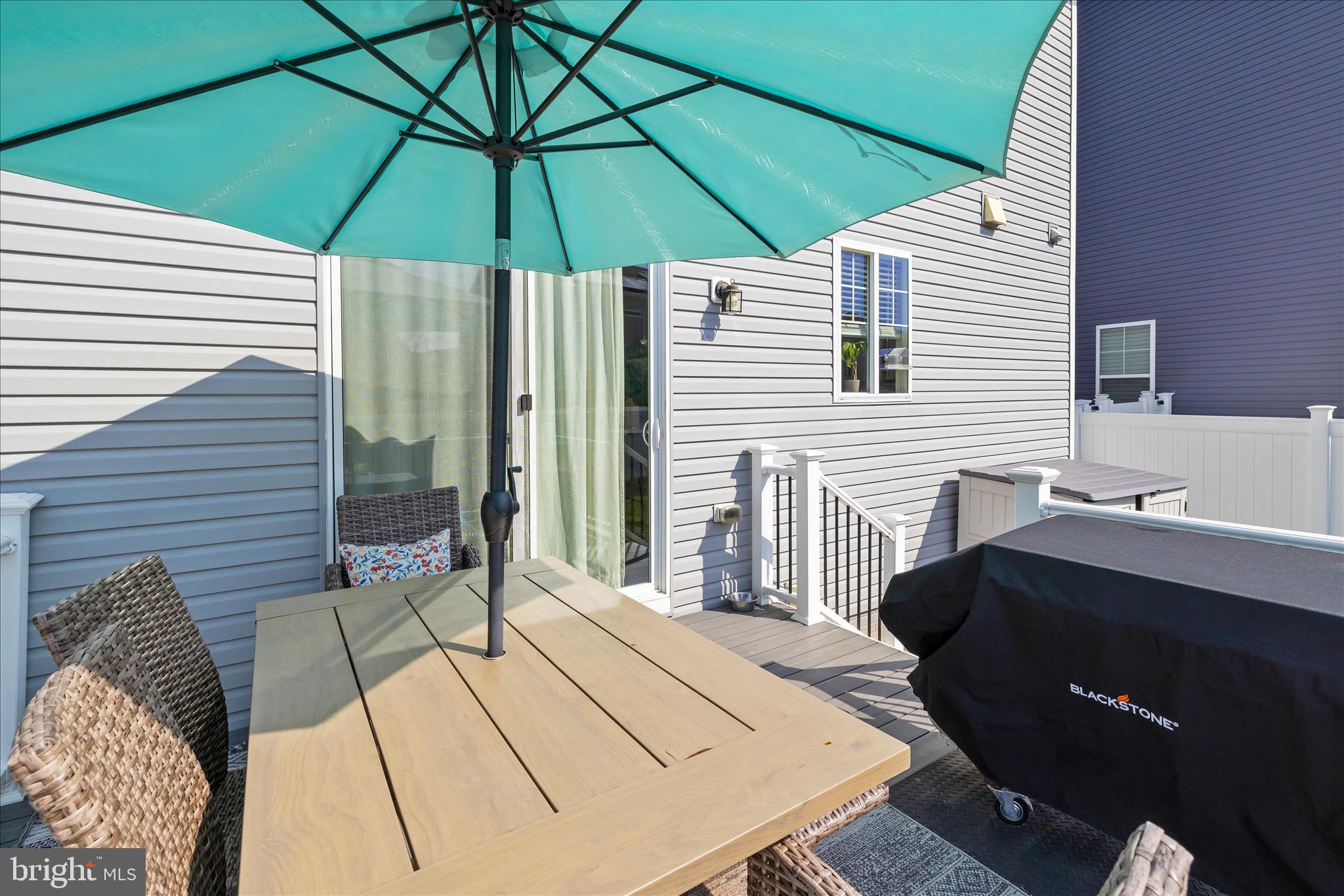 211 Harvest Blossom Road Millersville, MD 21108 - Photo 66 of 87 a backyard of a house with table and chairs