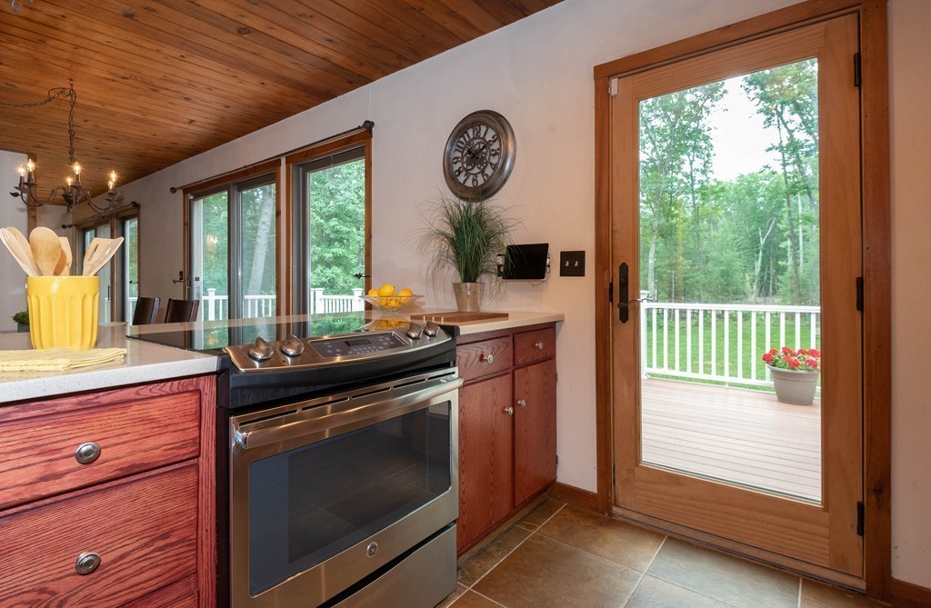 284 Main Street Boxford, MA 01921 - Photo 9 of 25 a kitchen with a stove and a white wooden cabinets