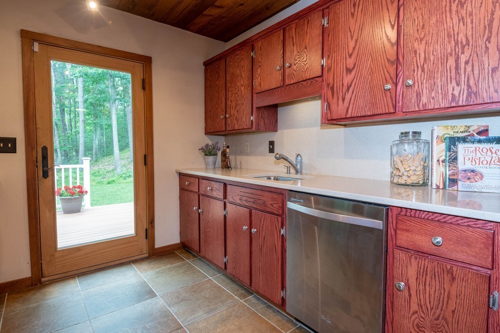 284 Main Street Boxford, MA 01921 - Photo 10 of 25 a kitchen with stainless steel appliances granite countertop a sink dishwasher stove and cabinets
