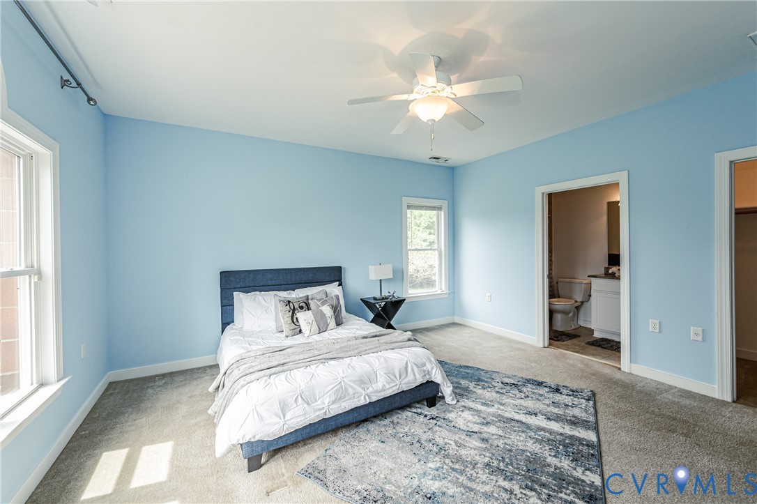 2018 Valentine Road Henrico, VA 23228 - Photo 38 of 65 a bedroom with a bed and a chandelier
