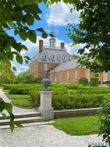 a view of a house covered with flower plants