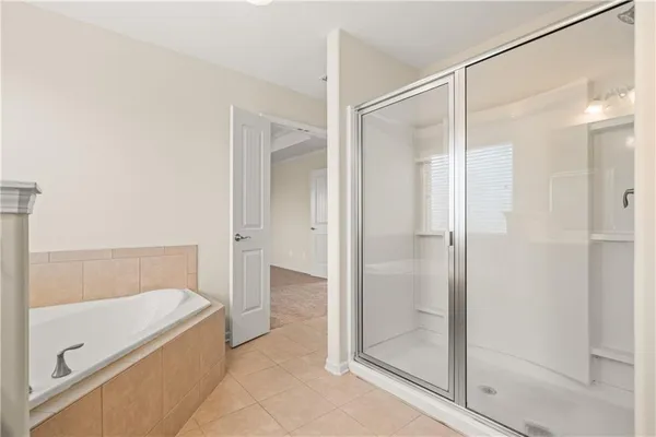 a bathroom with a tub and shower