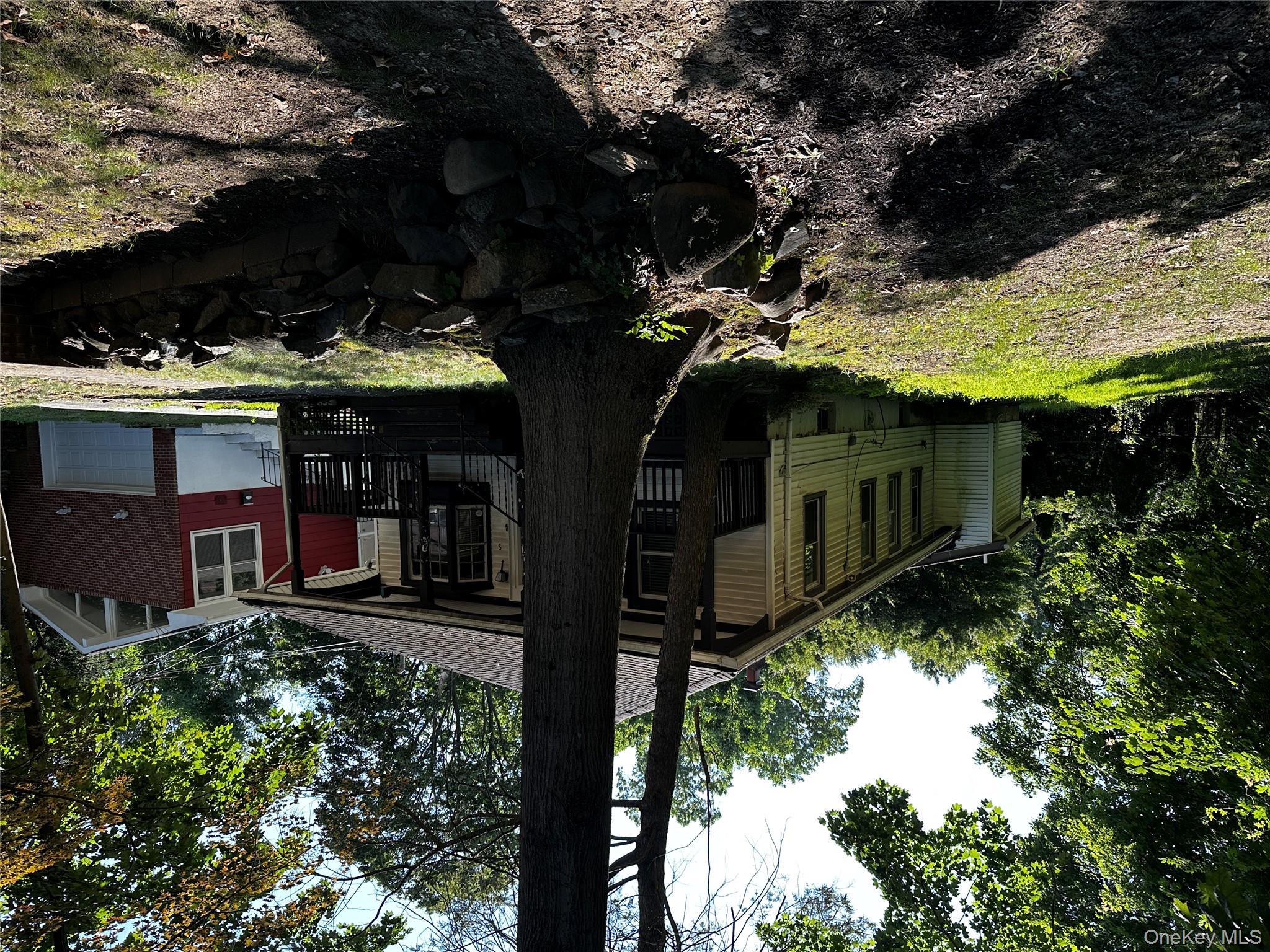 a view of a house with a backyard
