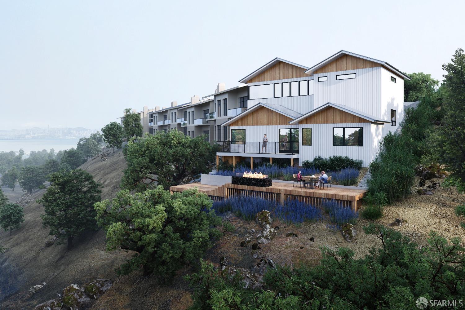 a view of a house with garden and sitting area