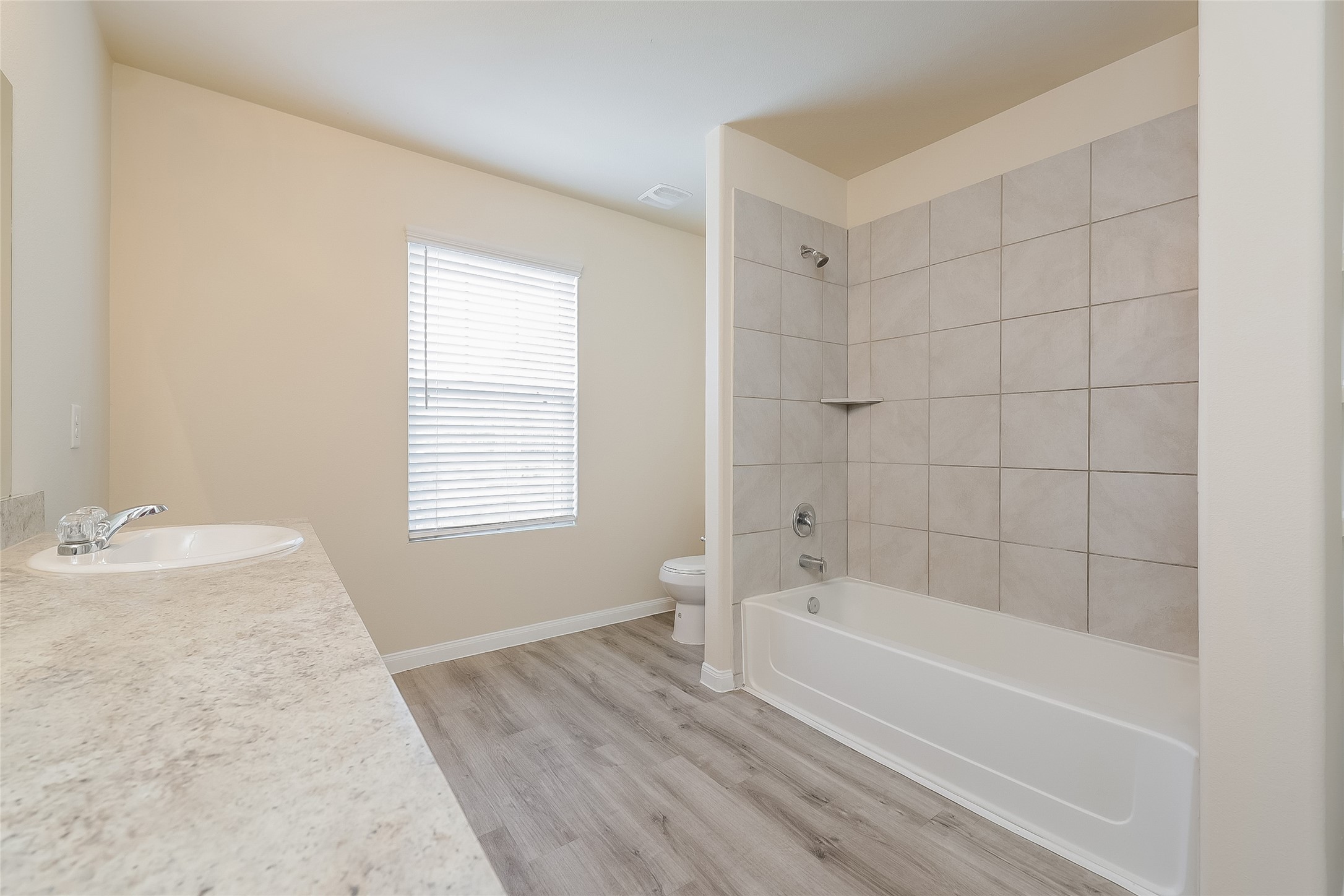 12702 Memorial Ranch Road Houston, TX 77014 - Photo 12 of 15 a bathroom with a granite countertop bathtub a sink and a shower