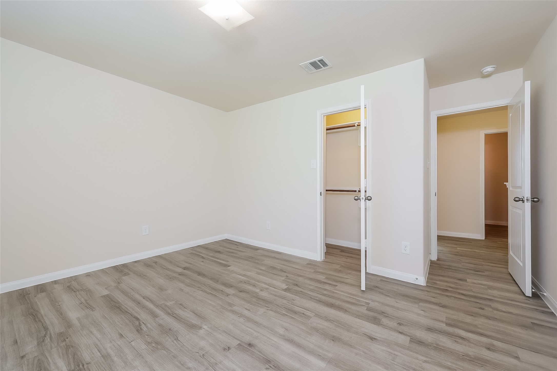 12702 Memorial Ranch Road Houston, TX 77014 - Photo 8 of 15 a view of empty room with wooden floor