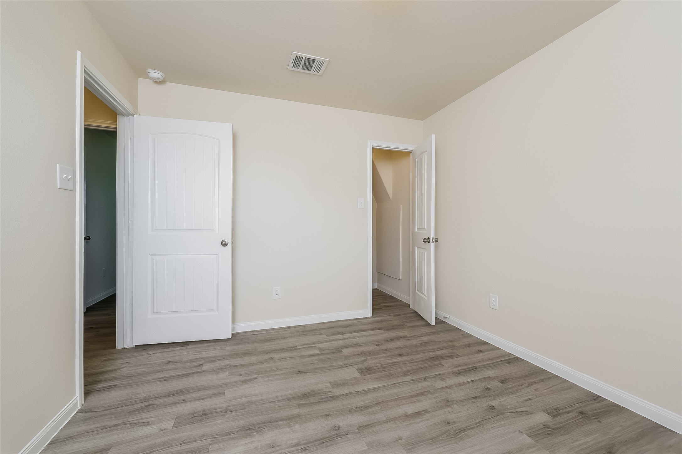 12702 Memorial Ranch Road Houston, TX 77014 - Photo 9 of 15 a view of an empty room with wooden floor
