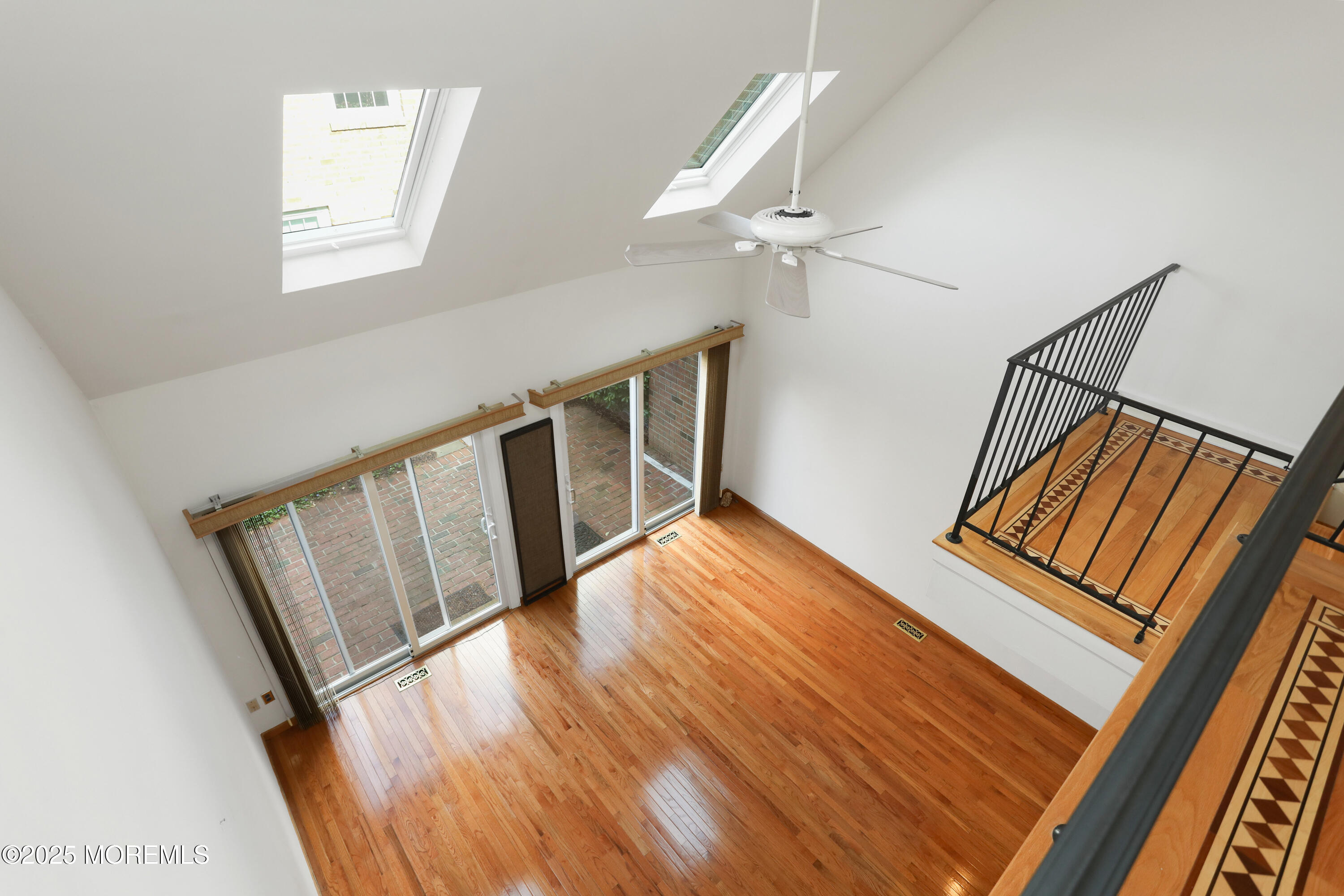 12 Wyckham Road Spring Lake Heights, NJ 07762 - Photo 16 of 39 a view of an empty room with wooden floor and stairs
